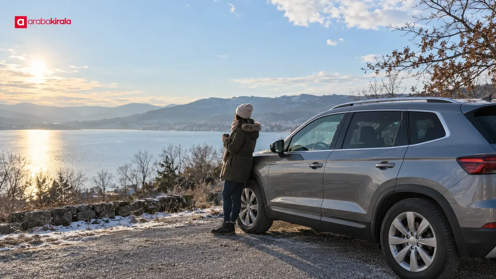 Car travelling beside Lake Sapanca under a cloudy winter sky