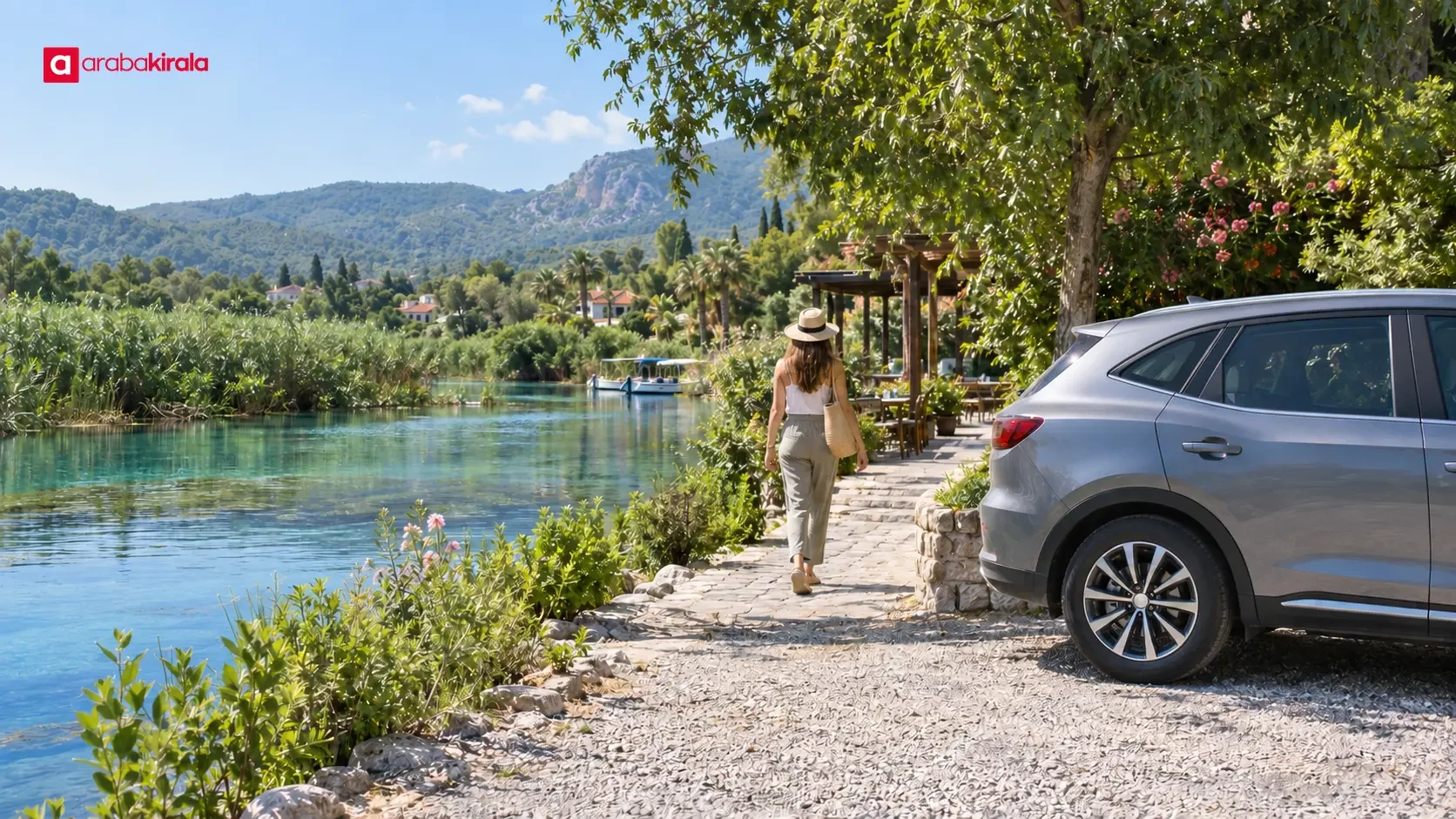 Visitors walking beside the Azmak in Akyaka on a summer day, with parked cars nearby