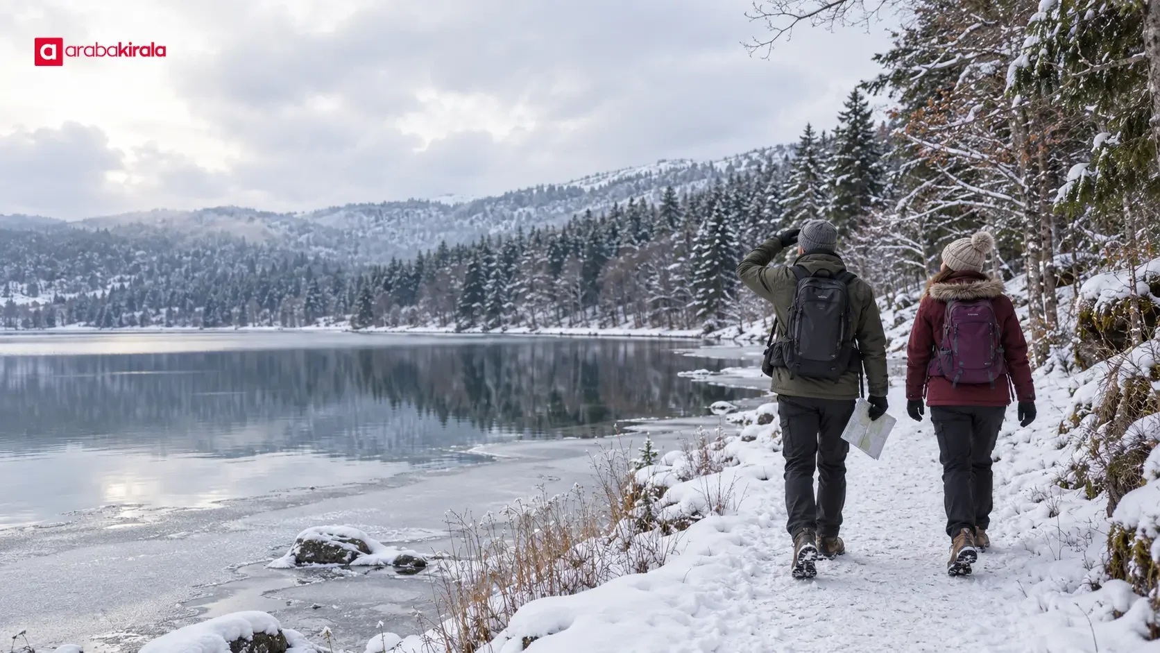 Visitors walking beside Lake Abant in winter