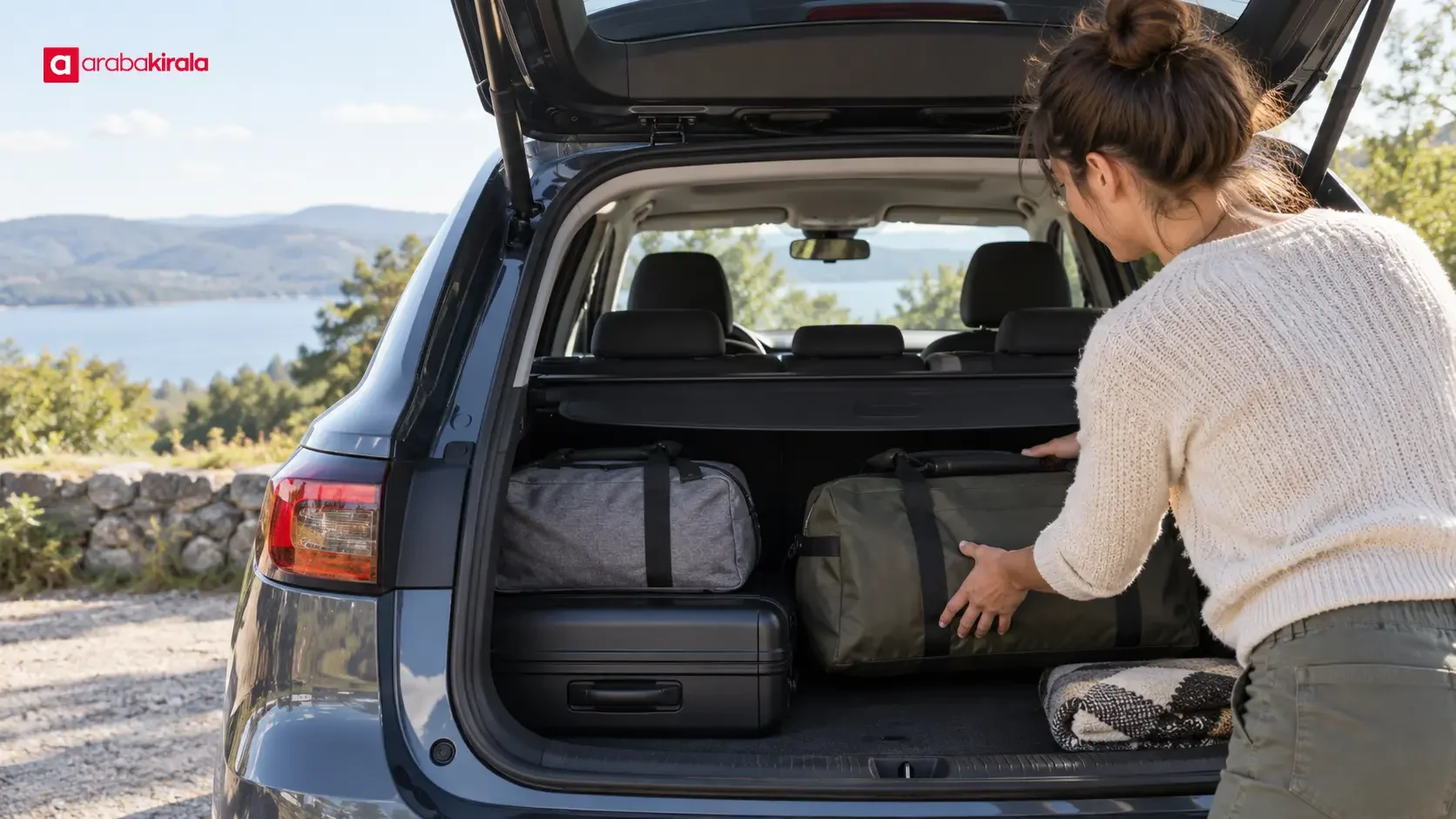 A traveler placing heavy suitcases low and close to the rear seat in a car trunk