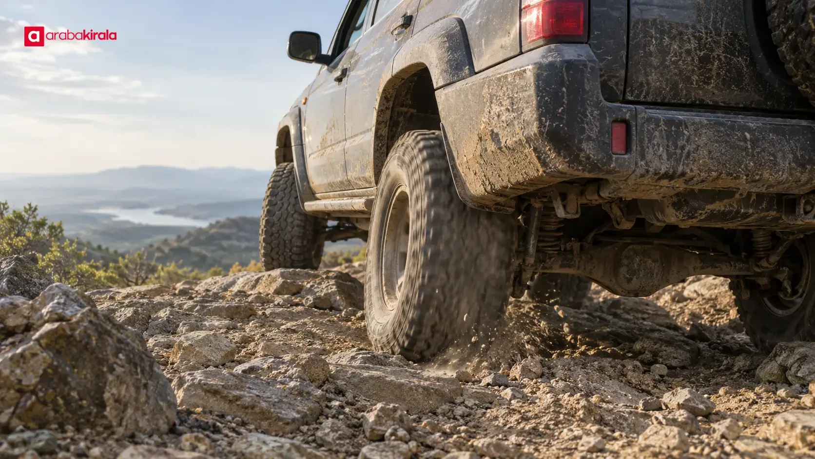 Off-road vehicle moving along a slippery trail with wheels on surfaces of differing grip