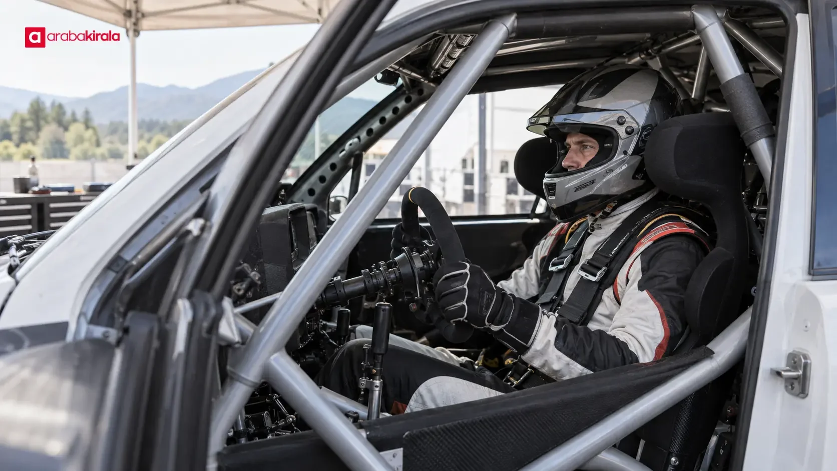 Metal safety cage running across the roof and sides of a rally car cabin